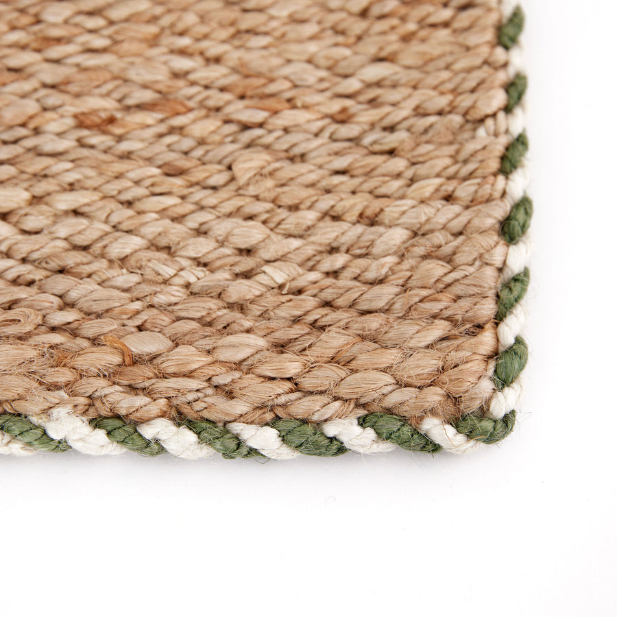 Detail Shot of Art of the Entry Braided Jute Doormat With Green Trim